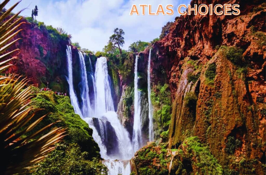 Majestic Ouzoud Waterfalls in Morocco surrounded by lush greenery, a perfect day trip from Marrakech.