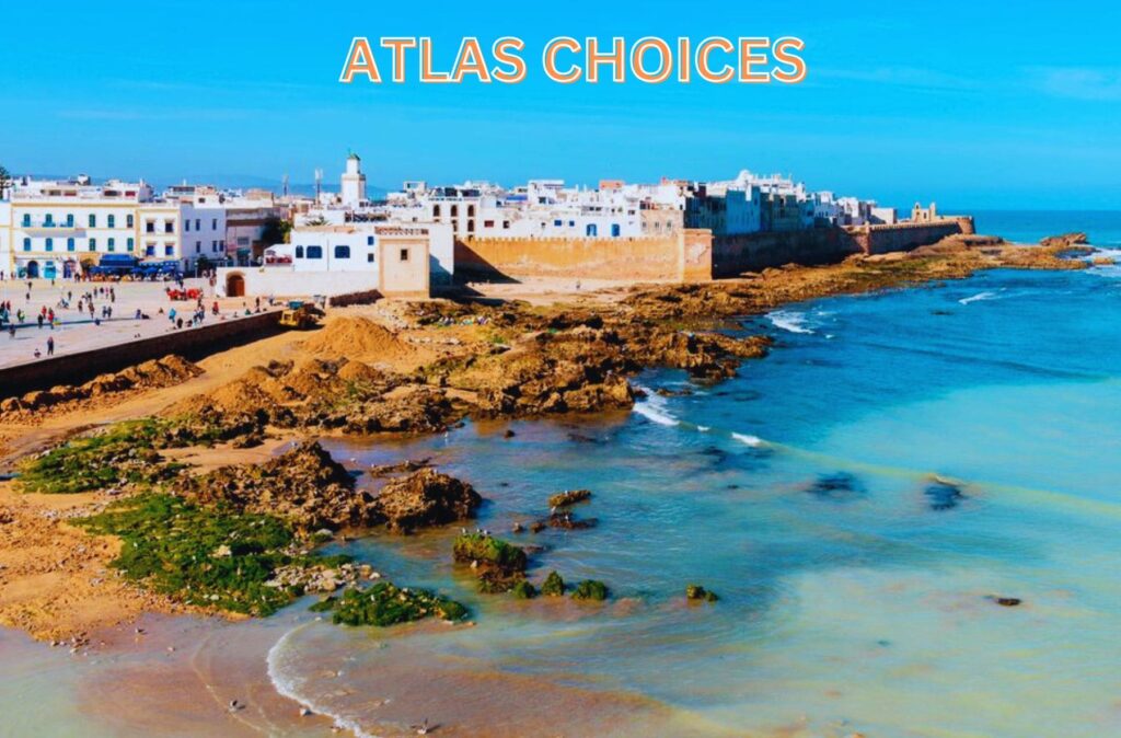 Wide sandy beach in Essaouira with gentle waves and a clear blue sky.