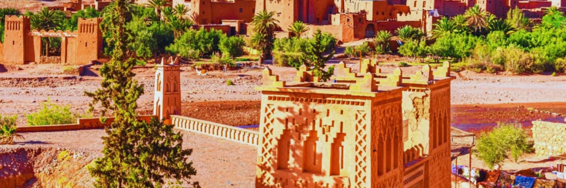 A view of Kasbah Ait Ben Haddou with its distinctive earthen buildings and dramatic backdrop.