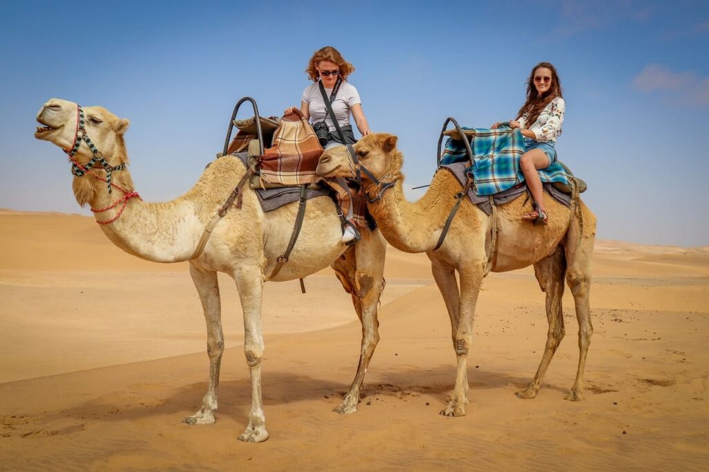 A luxury desert camp under a starlit sky in Erg Chebbi during a Marrakech to Fes tour.