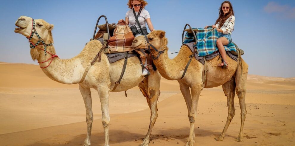 A luxury desert camp under a starlit sky in Erg Chebbi during a Marrakech to Fes tour.